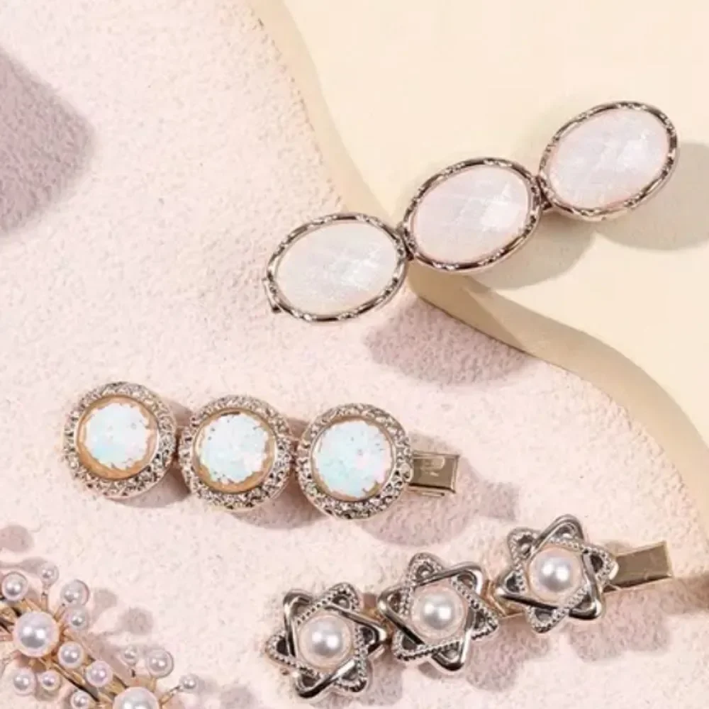 6 piece goldtone pearl shell clip set